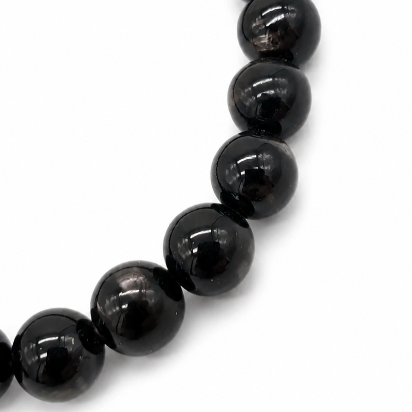 Hypersthene healing crystal bracelet detail, deep body colour and shifting silver flash