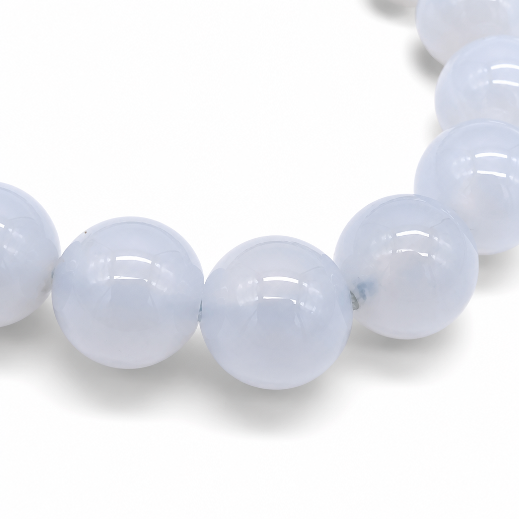 Handmade Blue Chalcedony pure crystal bracelet by AuraLune Crystal on white background