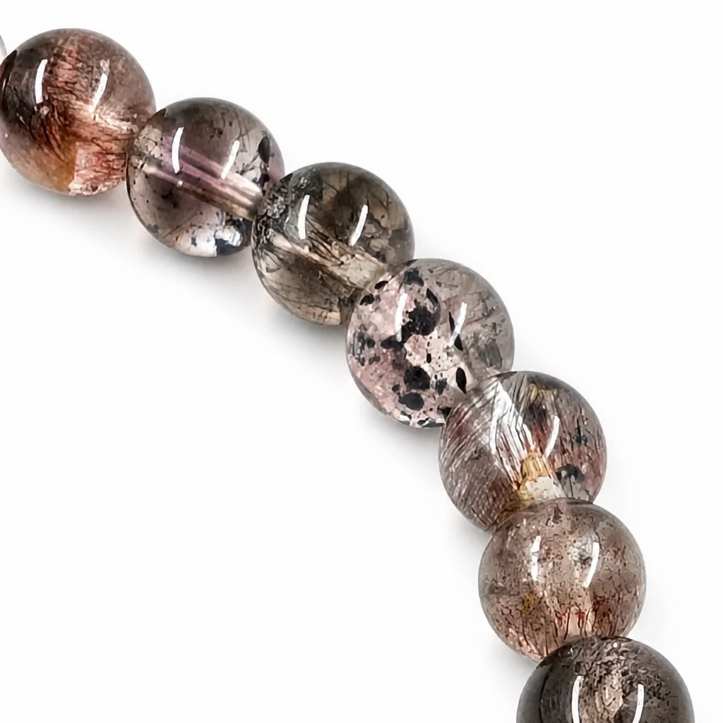 Handmade natural black super seven crystal bracelet by Aura Lune on white background