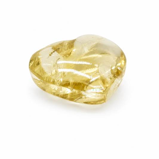 Compact natural citrine heart held to the light showing vivid prismatic rainbow veils