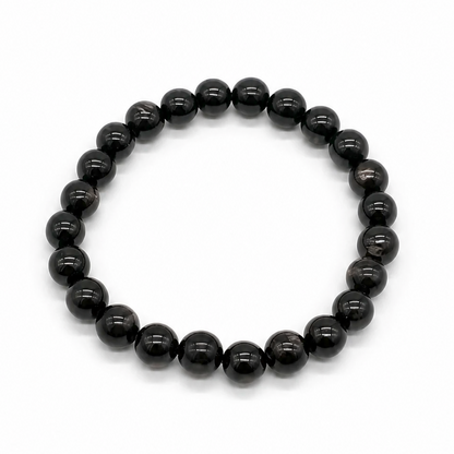 Hypersthene grounding crystal bracelet styled on wrist, minimalist Japanese-inspired styling