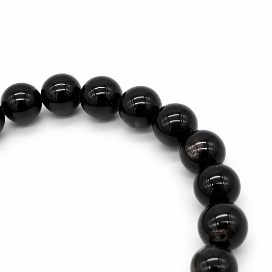 Close-up of hypersthene beads showing natural silvery adularescence, Aura Lune crystal jewellery