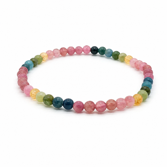Rainbow tourmaline bracelet with multi-colour round beads on a white background