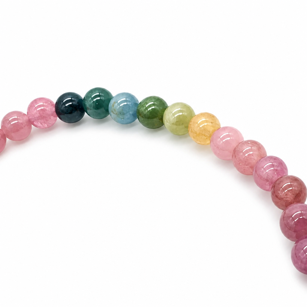 Close-up of natural un-dyed rainbow tourmaline beads on a bracelet