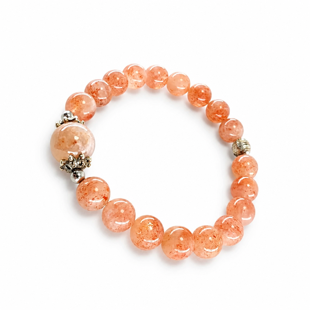 Sunstone beads showing copper shimmer in natural light