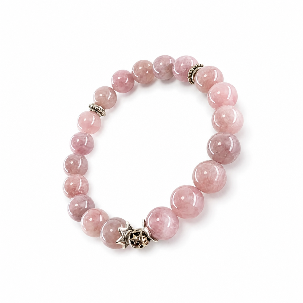 Silver filigree spacer beads beside lavender quartz, detail