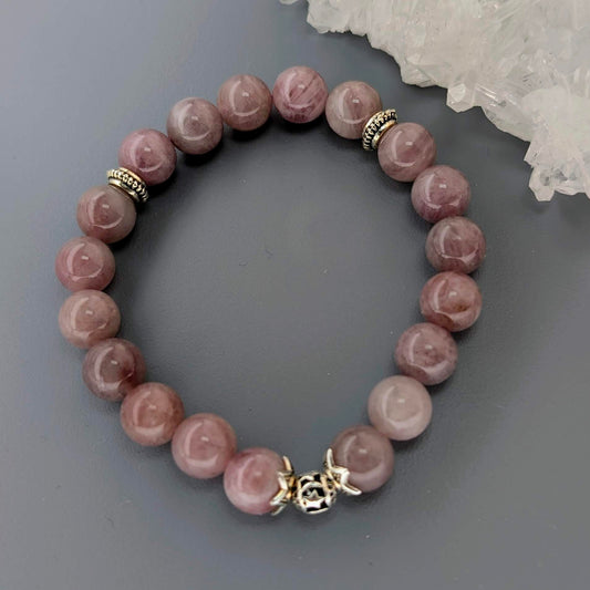 AuraLuneCrystal Purple Rose Quartz bracelet with translucent lavender-pink beads and intricate silver-toned filigree spacers.