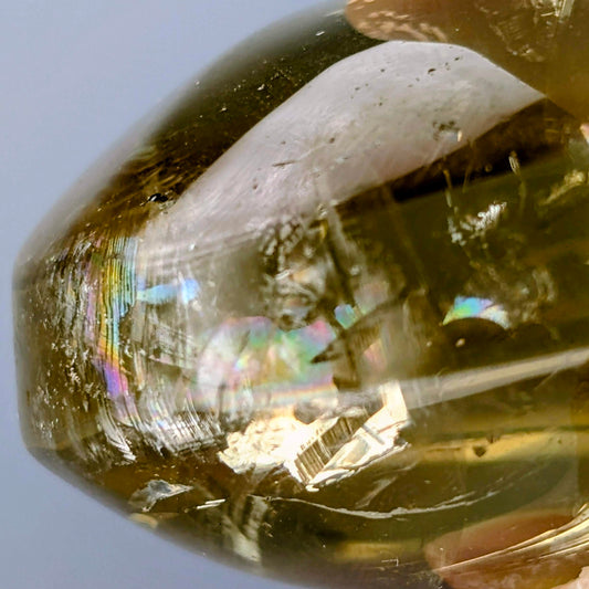 AuraLuneCrystal Amber Aurora Citrine heart specimen featuring golden honey-gold clarity and vivid internal rainbow light prisms.