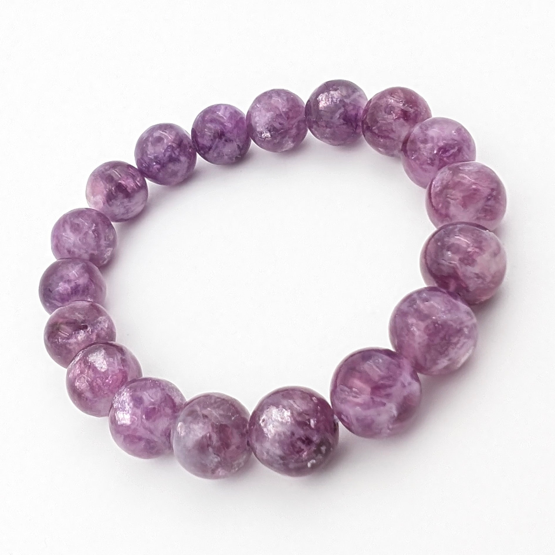 Handmade lepidolite bracelet curved to show even bead spacing