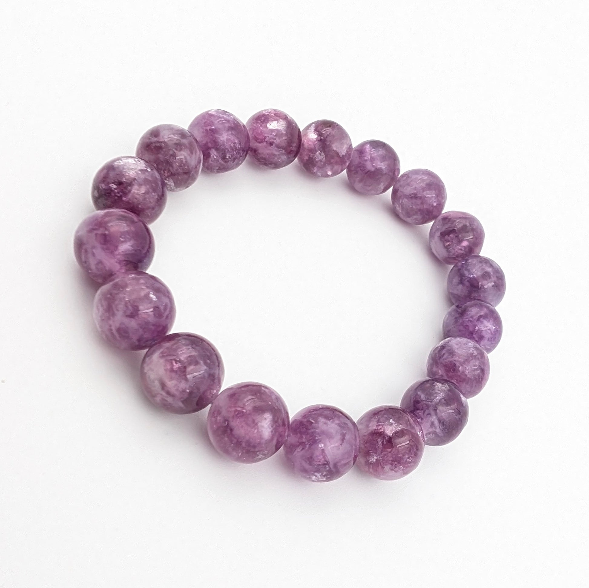 Natural lepidolite beads with silvery flecks through deep purple