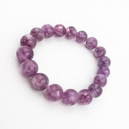 Natural lepidolite beads with silvery flecks through deep purple