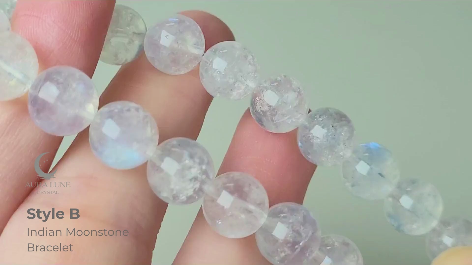 Indian moonstone bracelet with milky-opaque white 9mm round beads showing subtle blue and white sheen