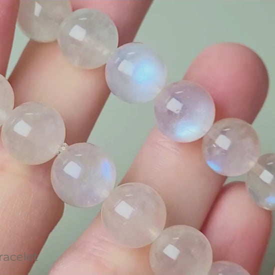 Sri Lanka Ceylon moonstone bracelet with translucent silvery-white round beads showing characteristic blue flash adularescence