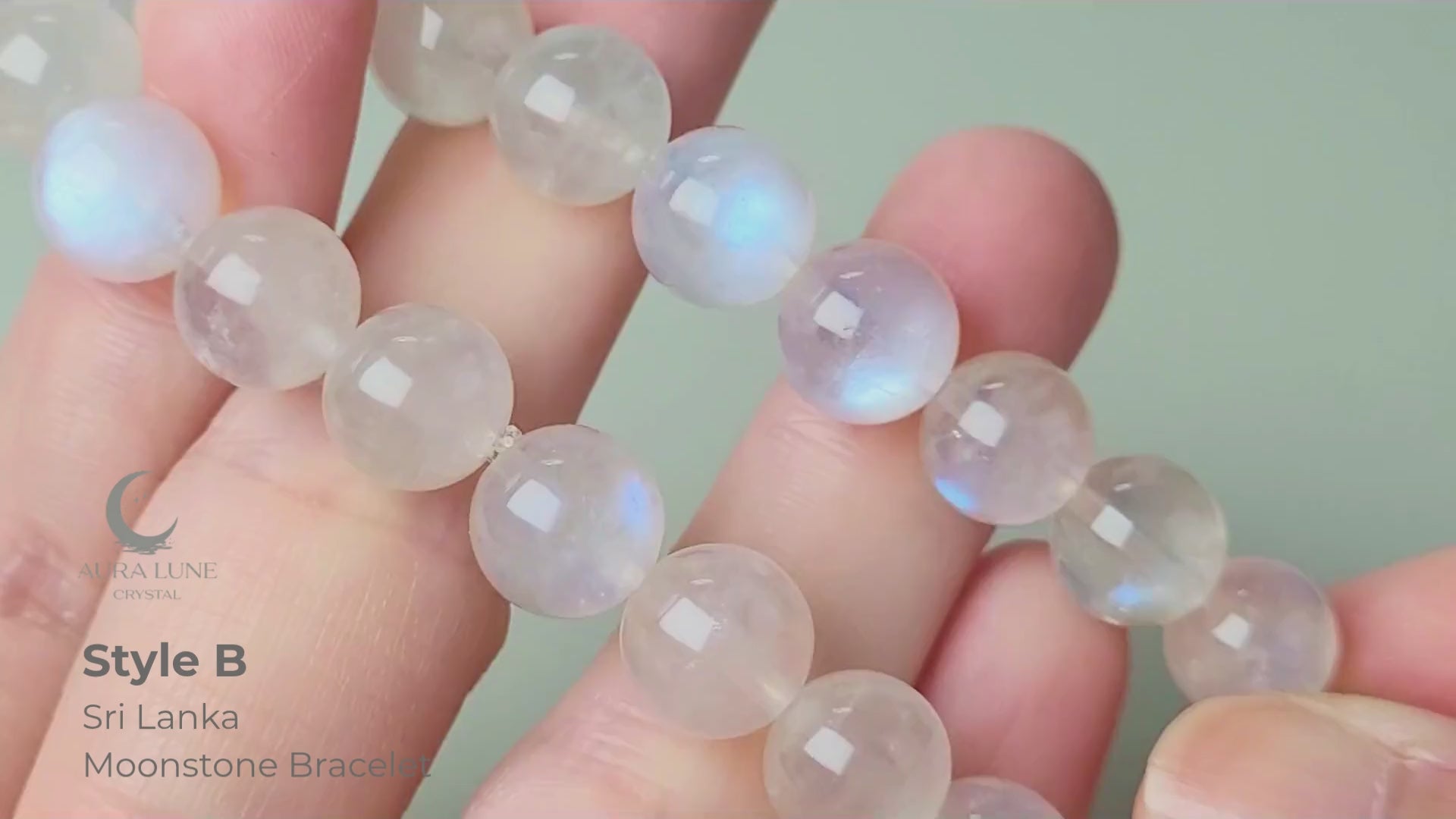 Sri Lanka Ceylon moonstone bracelet with translucent silvery-white round beads showing characteristic blue flash adularescence