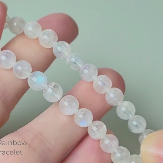 Madagascar Rainbow Moonstone Bracelet video — 6mm polished round beads showing live blue flash adularescence movement in natural light