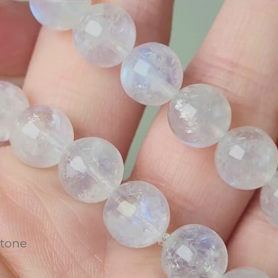 Indian moonstone bracelet with milky-opaque white 9mm round beads showing subtle blue and white sheen