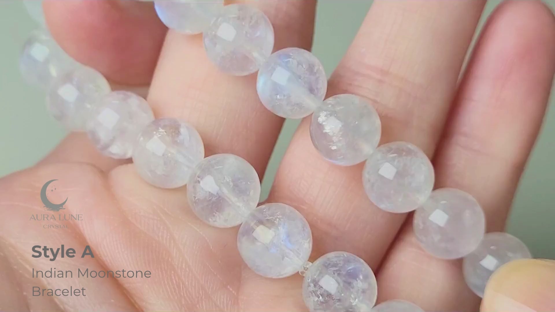 Indian moonstone bracelet with milky-opaque white 9mm round beads showing subtle blue and white sheen