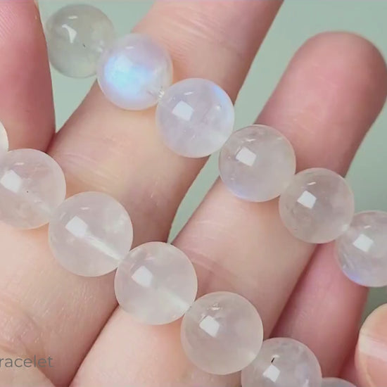 Sri Lanka Ceylon moonstone bracelet with translucent silvery-white round beads showing characteristic blue flash adularescence