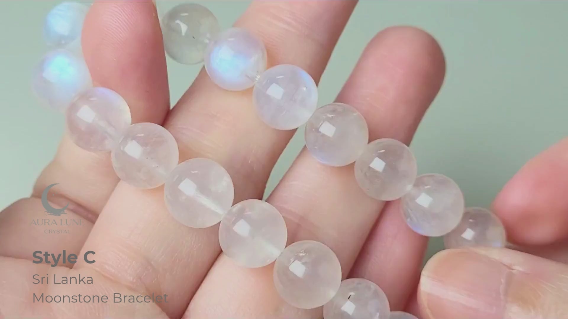 Sri Lanka Ceylon moonstone bracelet with translucent silvery-white round beads showing characteristic blue flash adularescence