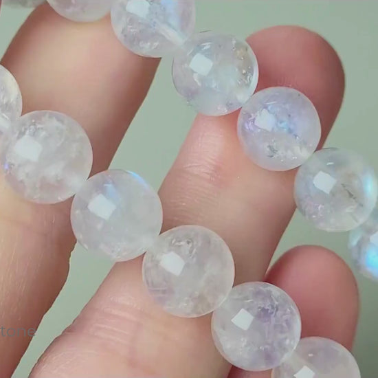 Indian moonstone bracelet with milky-opaque white 9mm round beads showing subtle blue and white sheen