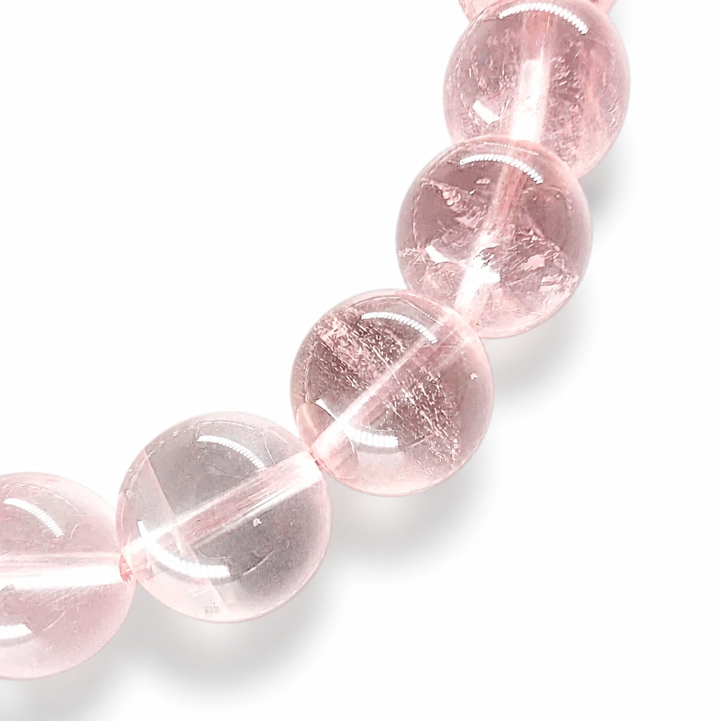 Handmade Madagascar Rose Quartz pure crystal bracelet by AuraLune Crystal on white background