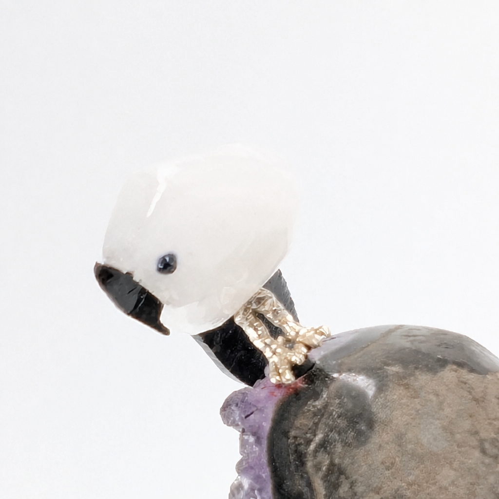 Full front view of the amethyst cluster and crystal parrot natural specimen