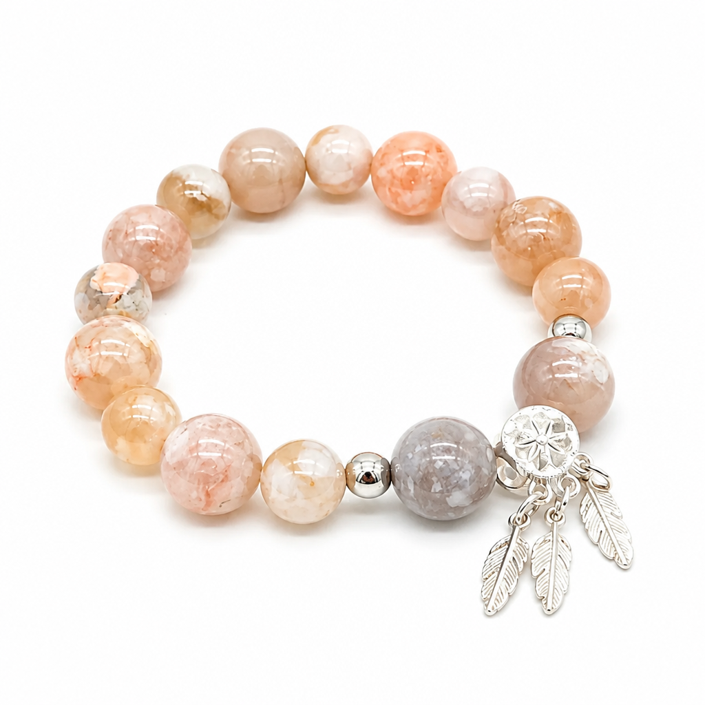 Close-up of white flower agate beads with pink and red blossom florets