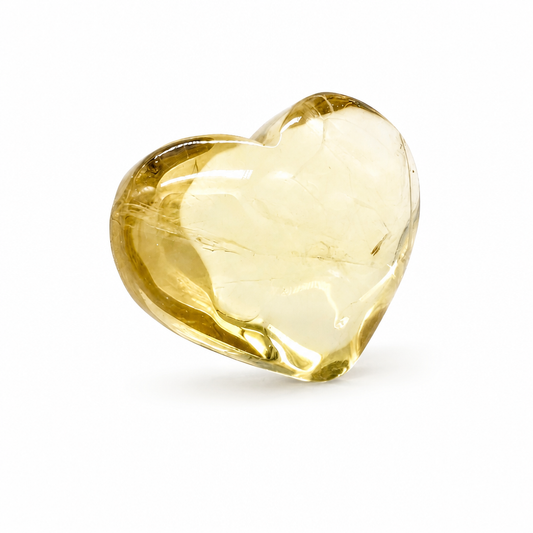 Natural citrine heart held to the light showing internal aurora veil inclusions
