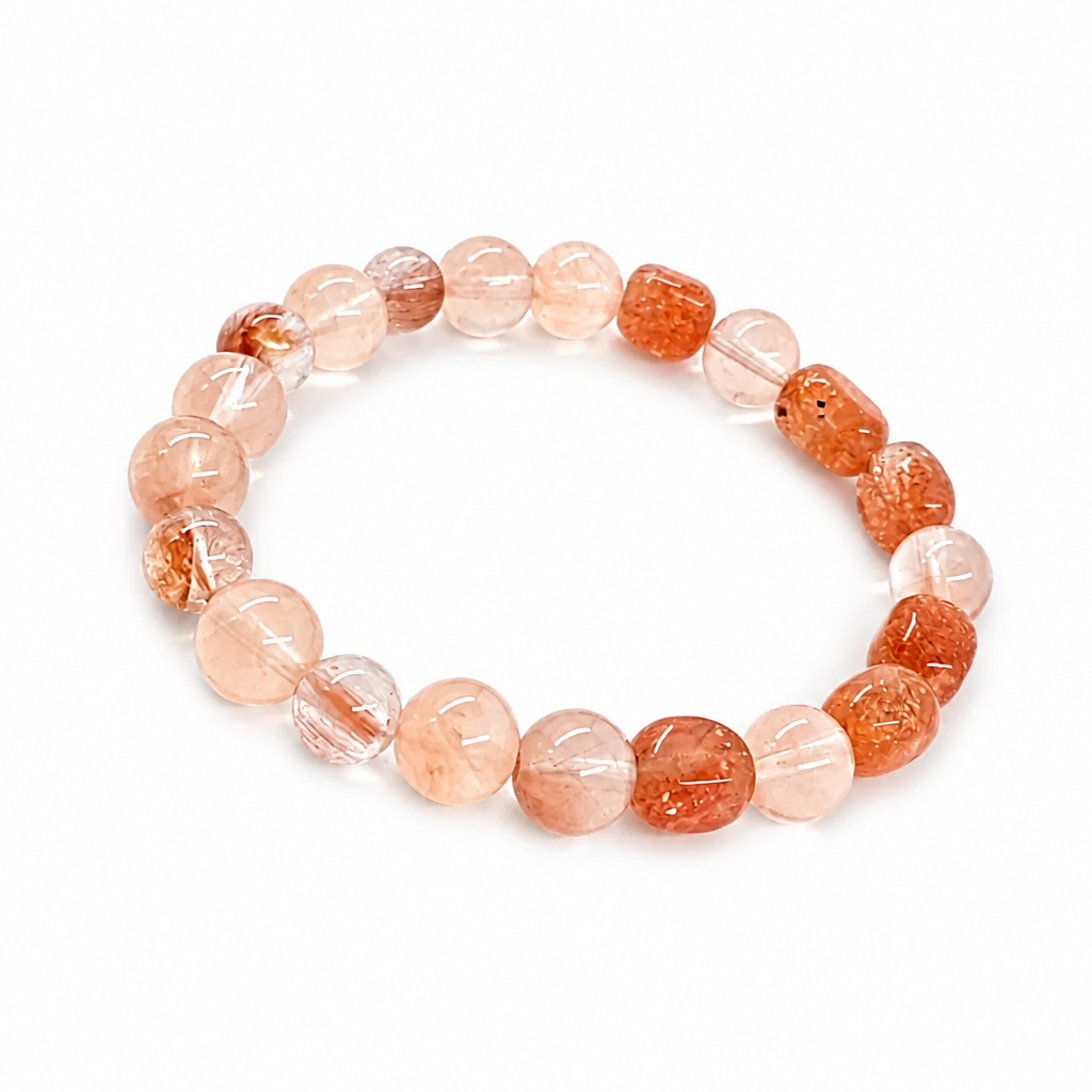 Sunstone and Rabbit Hair Quartz bracelet worn on the wrist in natural light