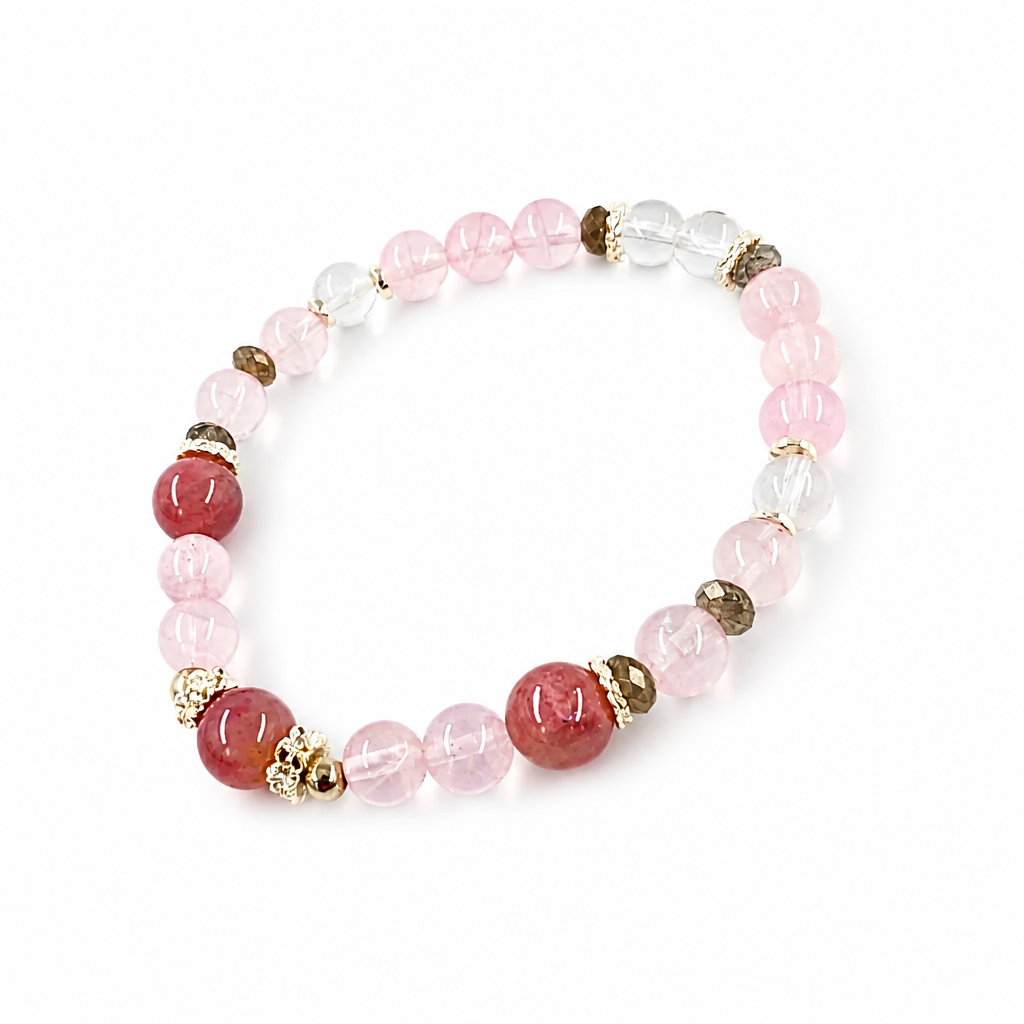 Labradorite bead showing blue flash beside rose quartz