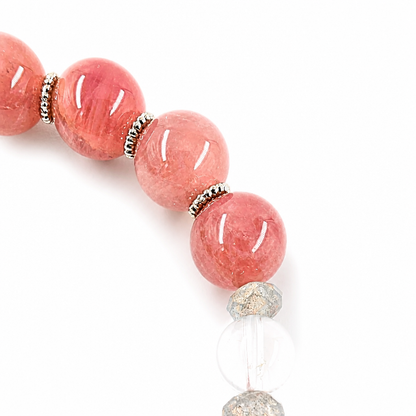Purple rose quartz and clear quartz floral bracelet on a white background