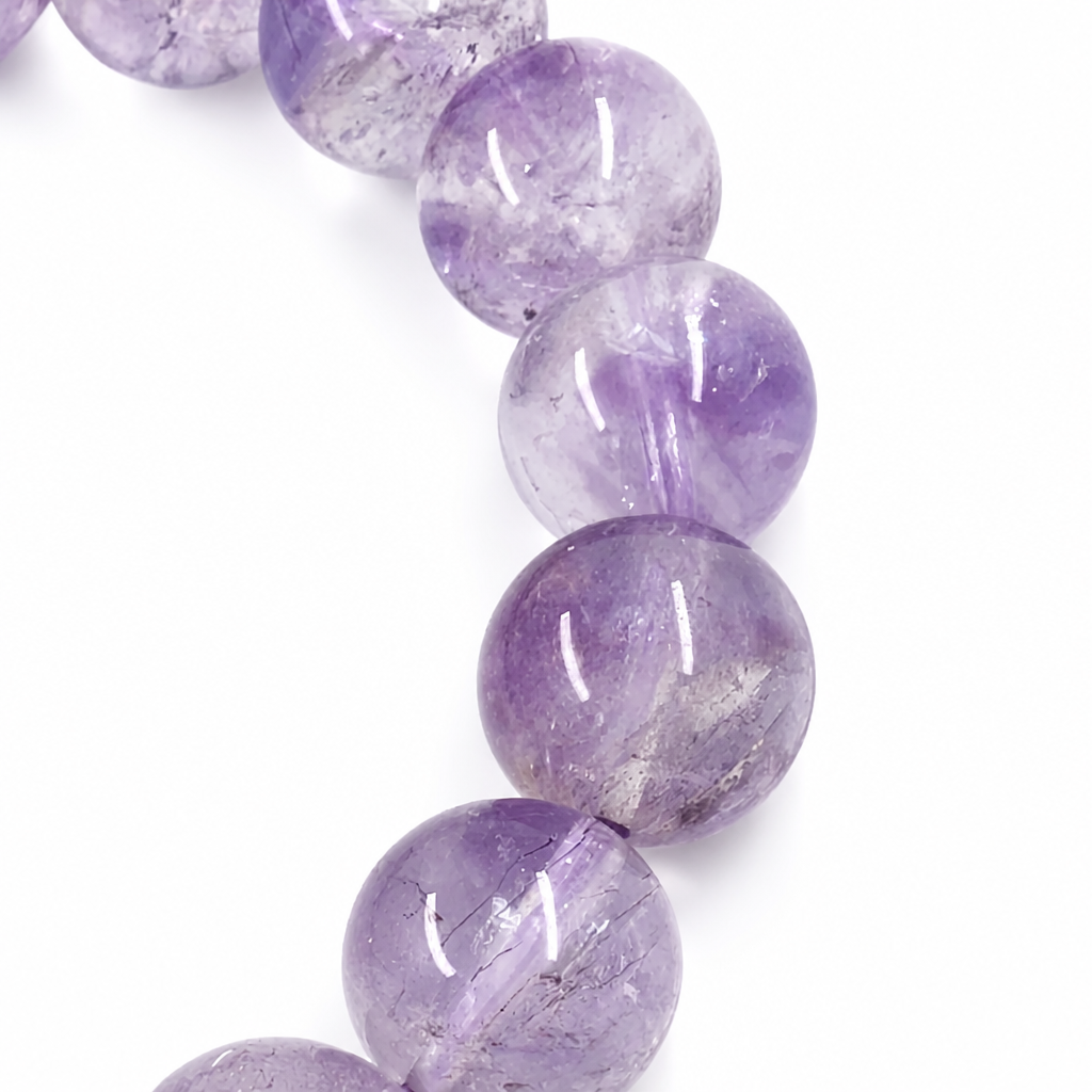 Side view of the Super Seven bracelet showing bead depth and mineral inclusions
