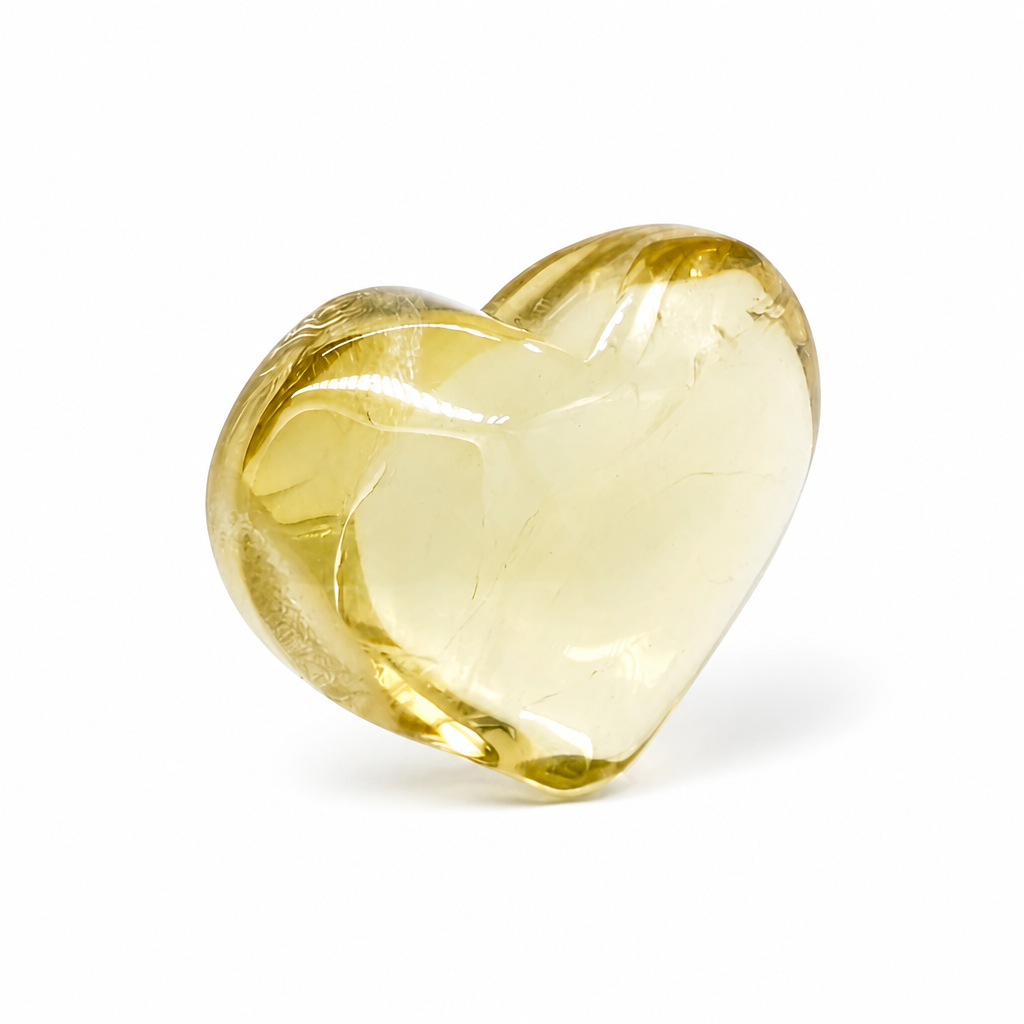 Aurora citrine heart catching angled light to reveal luminous veil inclusions