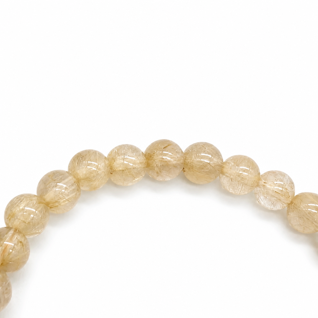 6mm rutilated quartz beads with golden needles on elastic cord