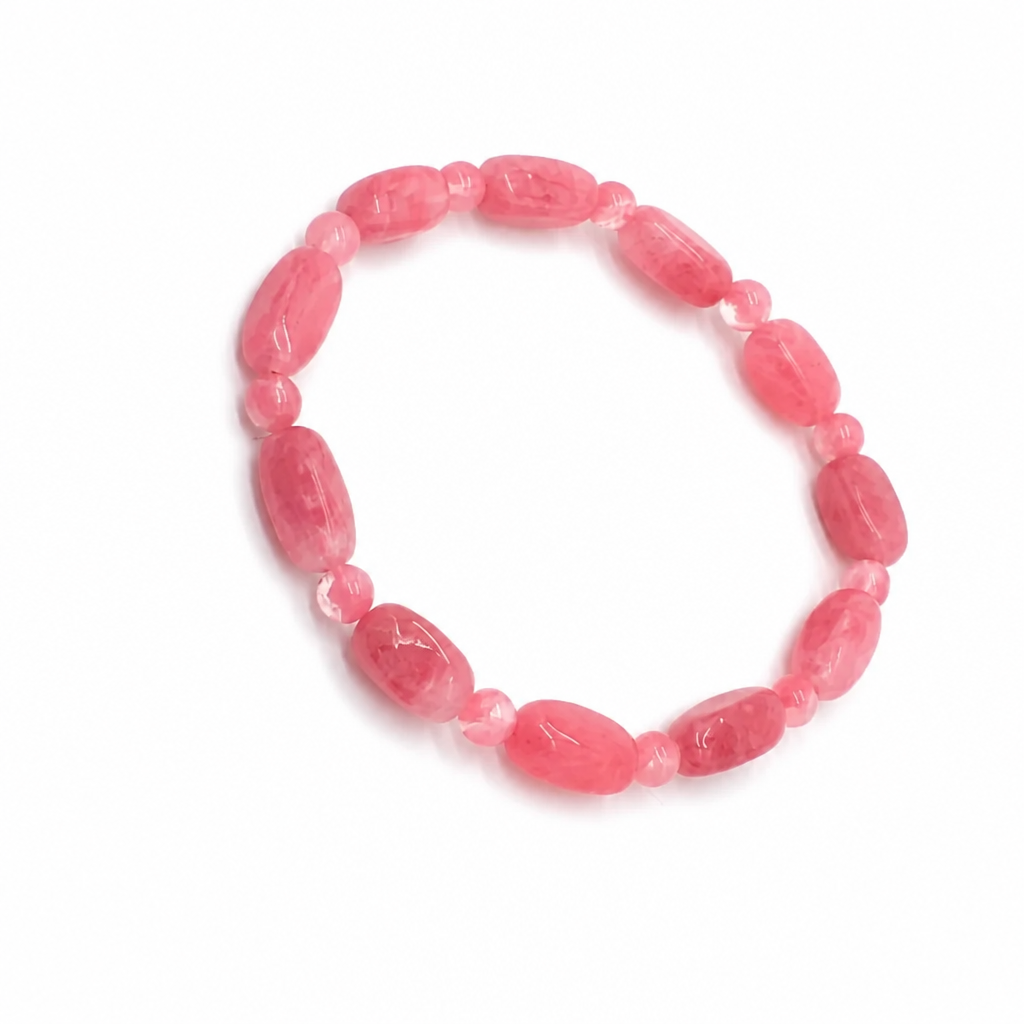 Irregular hand-cut rhodonite bead showing black veins