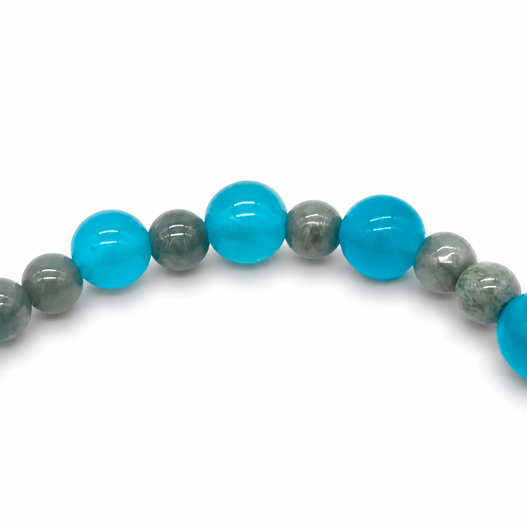 Verdant Voyager designer bracelet worn on the wrist showing green and grey-blue tones
