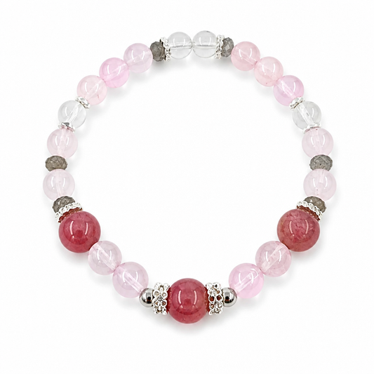 Close-up of lavender purple rose quartz, blush rose quartz, labradorite and clear quartz beads