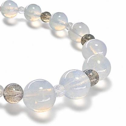 Moon Tide Full Moon bracelet resting flat showing natural visual tide of mixed moonstone beads