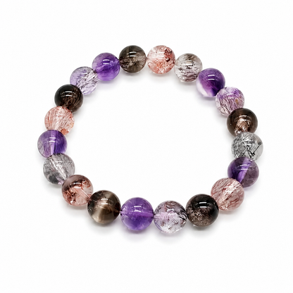 Super 7 bead revealing seven-mineral inclusions under light