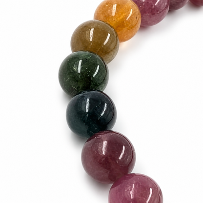Natural colour zoning visible in a single 7.5mm rainbow tourmaline bead close-up