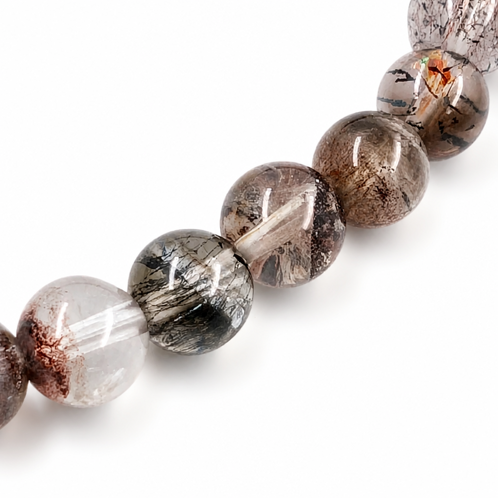 Angled view of the Black Super Seven bracelet catching light to reveal hidden threads