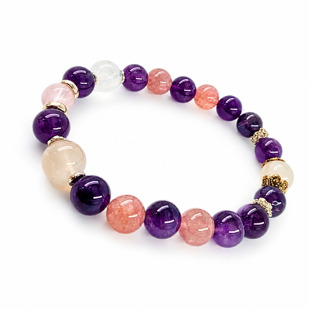 Four-stone bracelet detail with gold and silver floral spacers