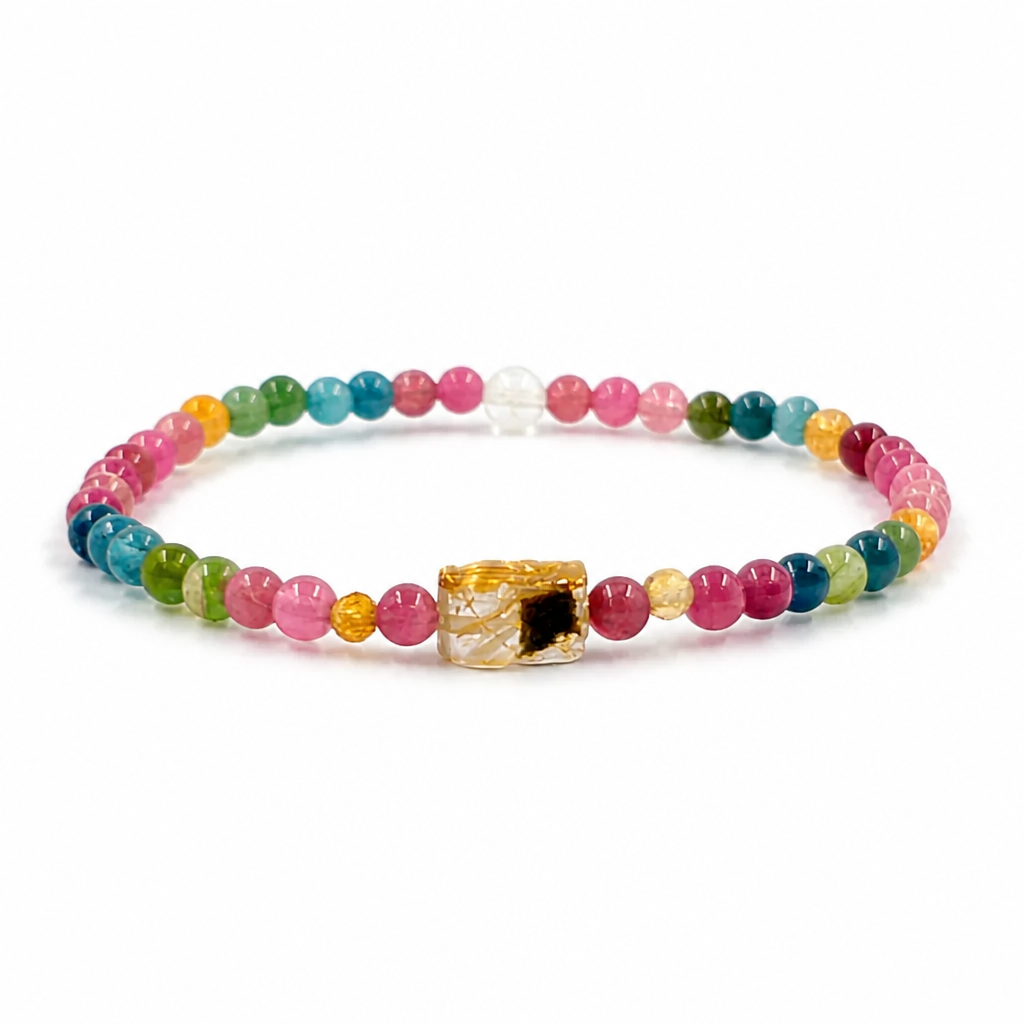 Golden Pixiu charm centred on a natural rainbow tourmaline bracelet