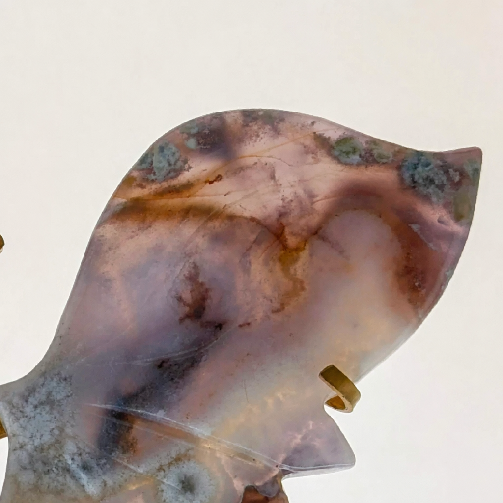 Deep azure-indigo tones of the carved flower agate butterfly