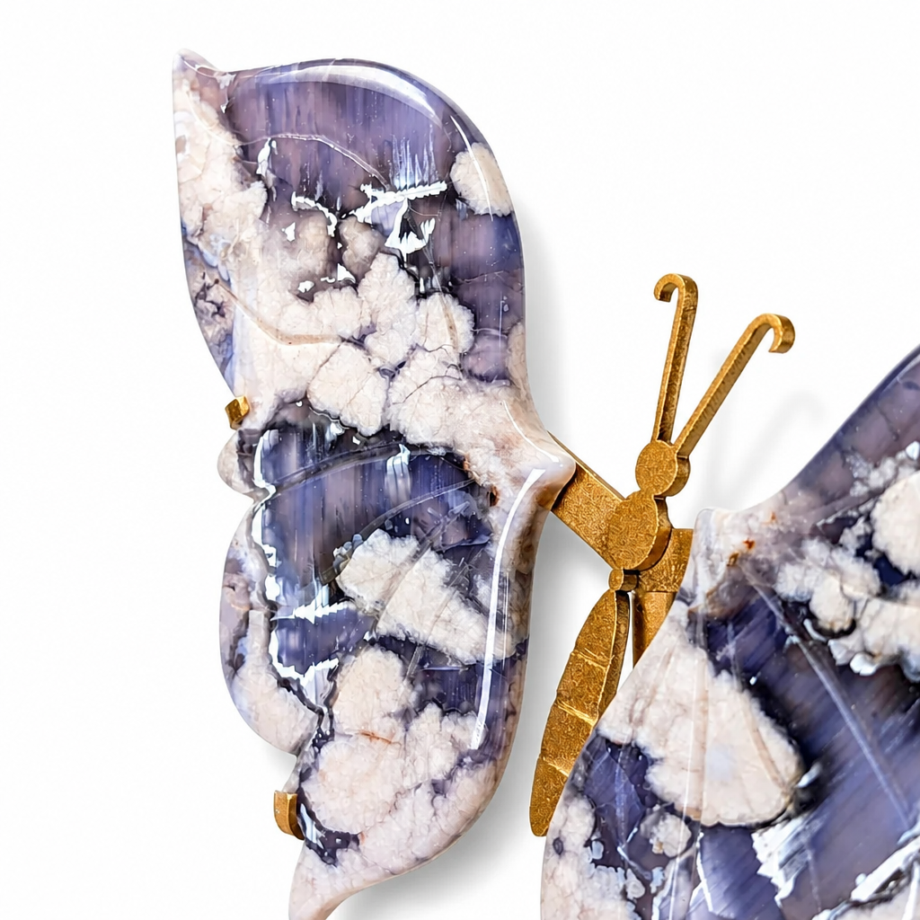 Gold butterfly stand holding the natural indigo agate specimen