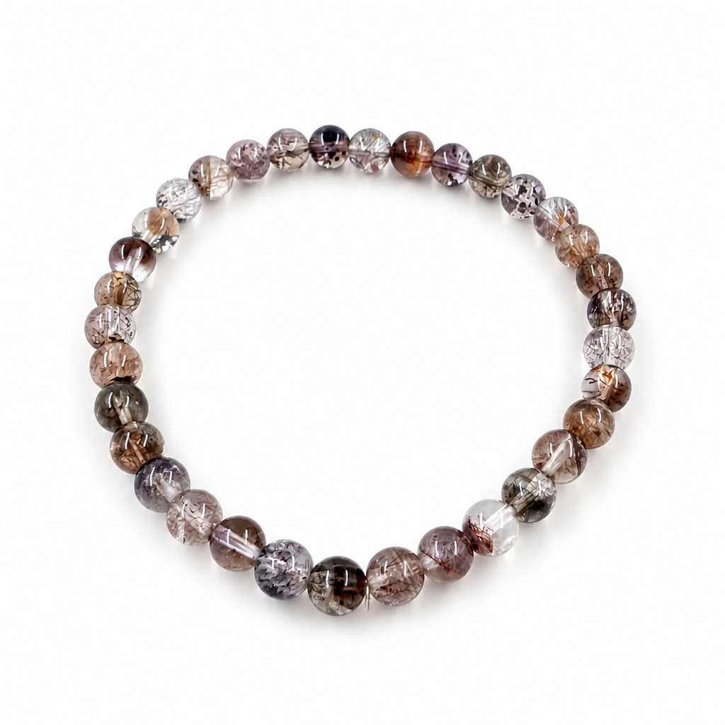 Close-up of gold rutile and red lepidocrocite threads inside black super seven beads