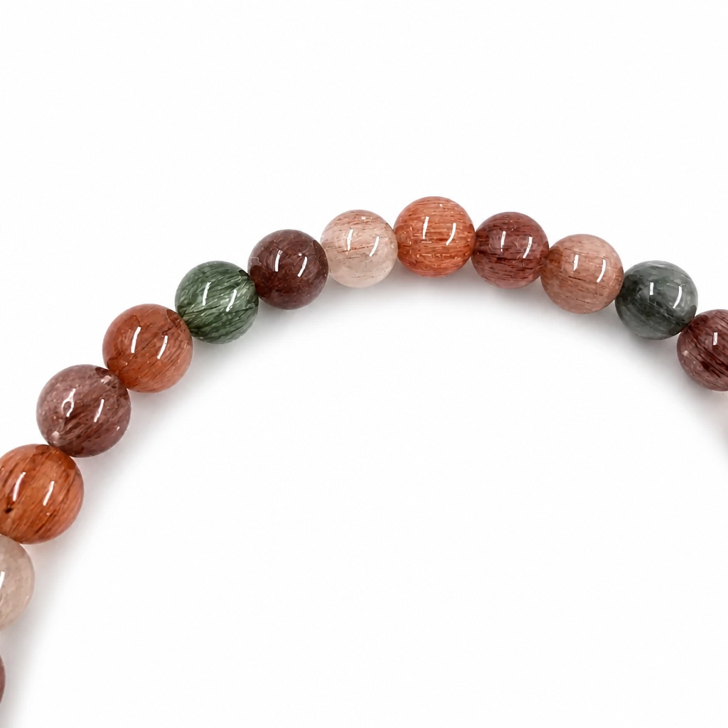 Rabbit Hair Quartz bracelet resting flat showing constellation of natural rutile needles
