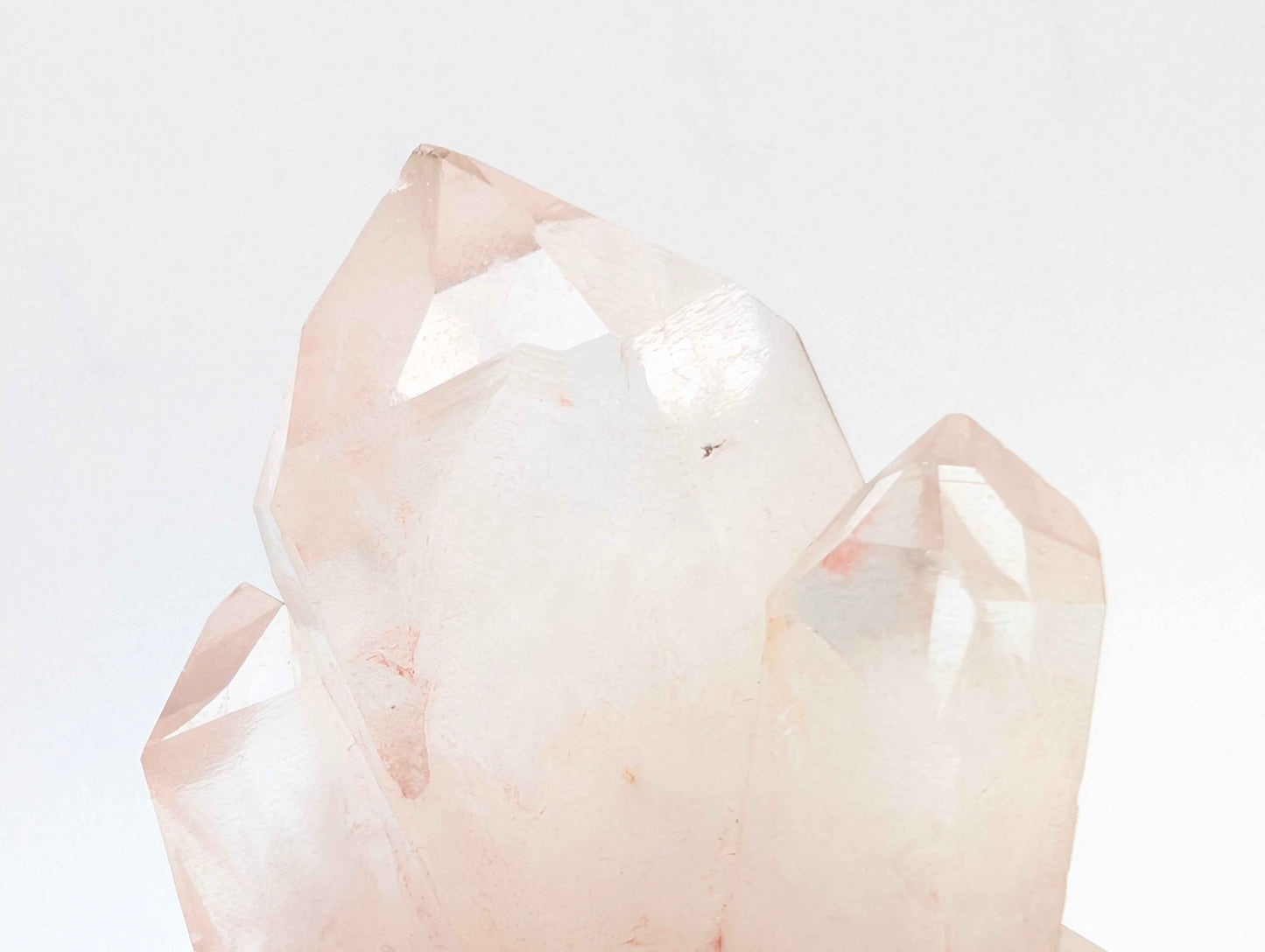 Angled view of the Pink Samadhi Quartz cluster showing crystal point formation