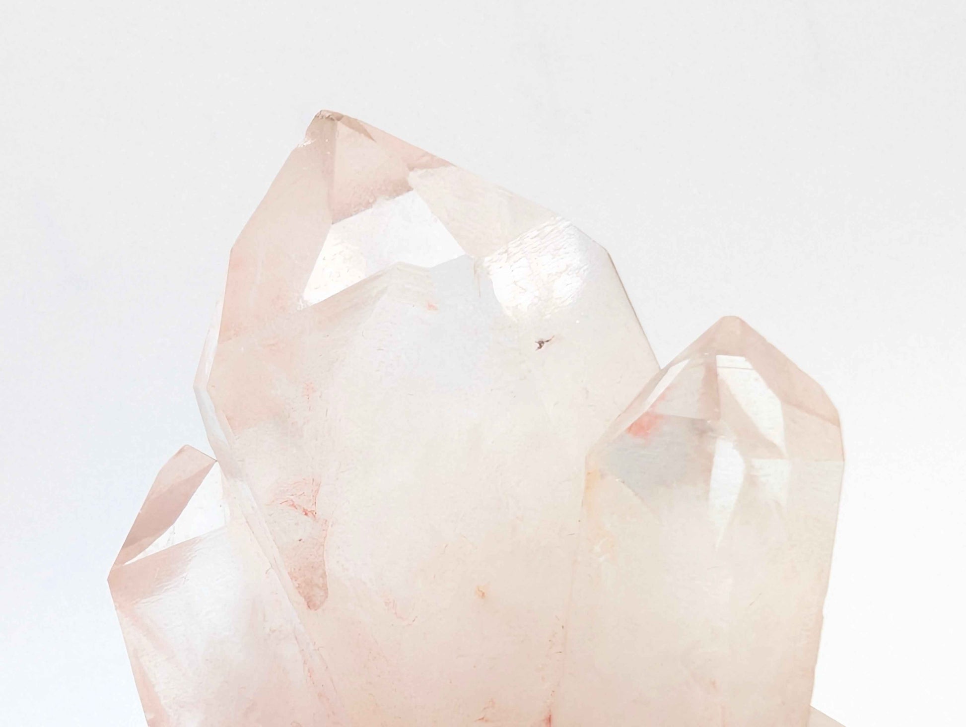 Angled view of the Pink Samadhi Quartz cluster showing crystal point formation