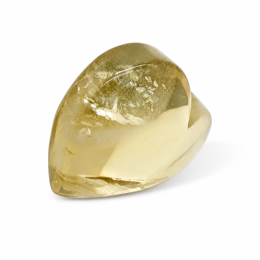 Natural citrine heart held to the light showing rare internal rainbow inclusions